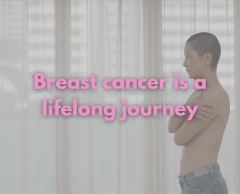 Breast Cancer a life long journey: a woman covering her chest after breast cancer surgery